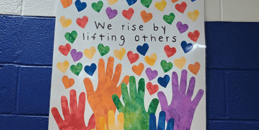 A school hallway poster reading 